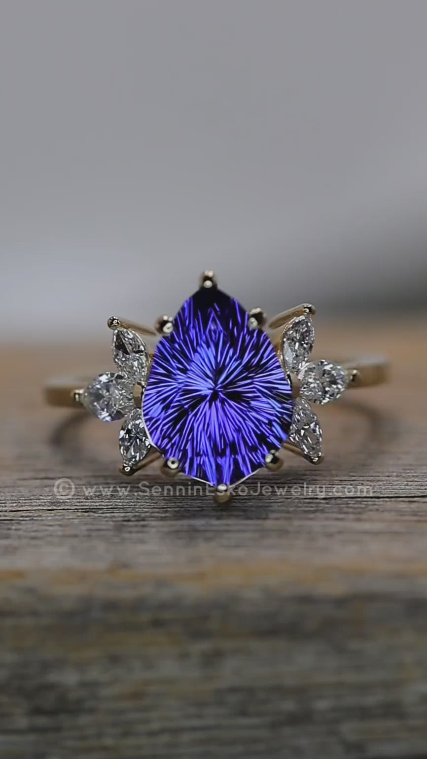 18kt Gold Multi Prong Setting with Large Diamond Marquise Accents - Depicted with a 3.9 Carat Tanzanite Tear Drop (Setting Only, Center Stone Sold Separately)