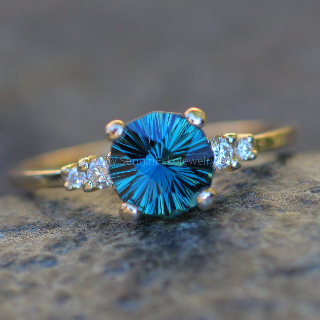 Five Stone Diamond Accented Multi Prong Setting Depicted with a Teal Sapphire (Setting Only, Center Stone Sold Separately)