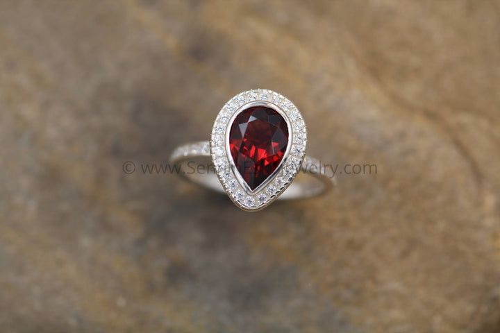 Diamond Halo Ring with Channel Set Band - Depcited with a Pear Cut Garnet (Setting Only, Center Stone Sold Separately) Sennin Esko Jewelry Alternative Engagem, Diamond Engagement, Diamond Garnet Ring, Engagement Ring, Garnet, Garnet Bezel  Loose Settings